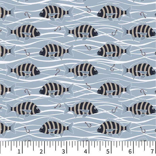 Fabric swatch with black and white striped fish pattern on a blue background