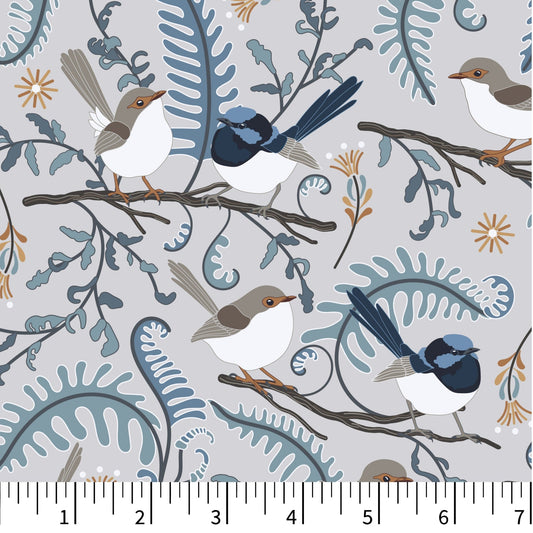 Patterned fabric swatch with birds and branches, shown with a ruler for scale.